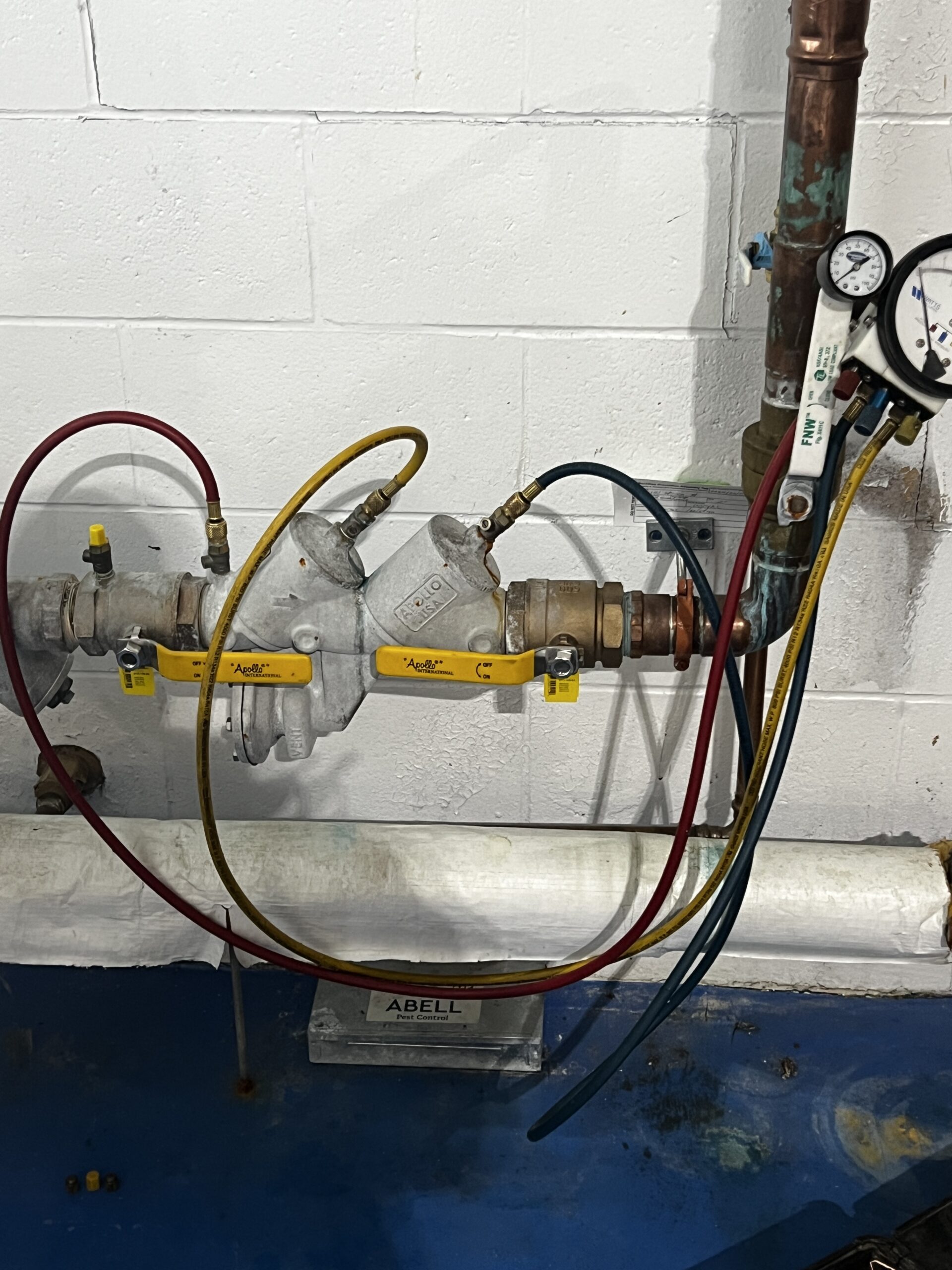 Triton Home Service licensed backflow tester performing annual backflow test in London Ontario