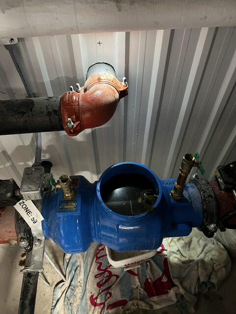 6-inch Watts 350 backflow preventer with top cover removed, exposing internal check valve chambers and sealing seats.